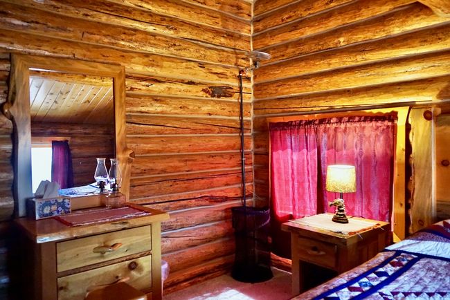Upstairs Bedroom featuring log walls | Image 44