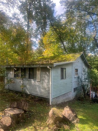 View of side of property with a yard | Image 1