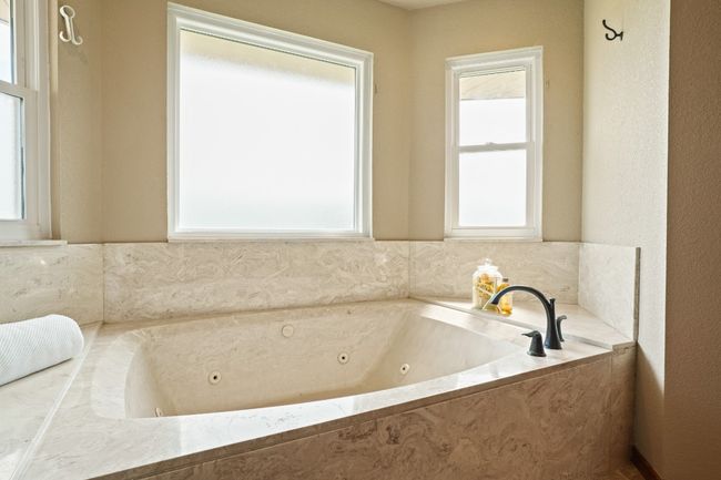 Bathroom featuring a jetted tub in primary bath | Image 14