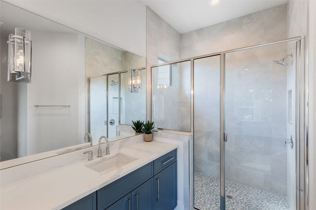 Bathroom 3 en-suite with vanity, a walk-in shower, and recessed lighting. | Image 32