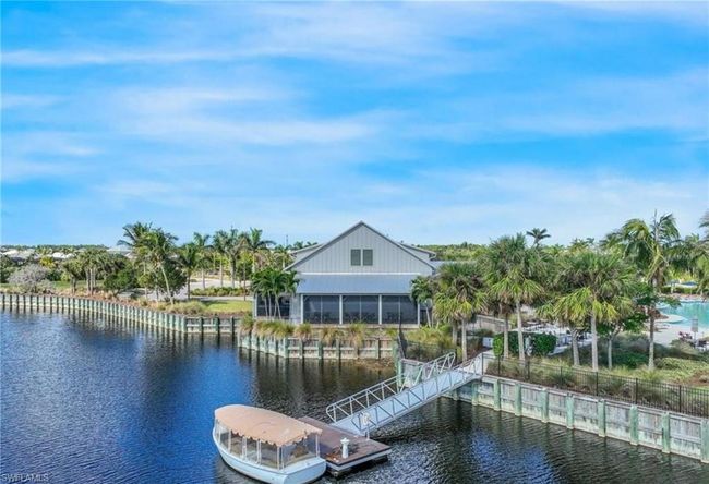 Dock area featuring a water view | Image 28