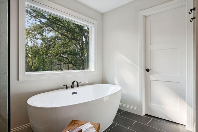 Deep, soaking tub in Primary Bathroom | Image 30