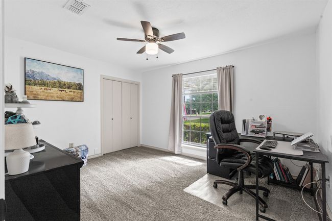 Carpeted office space with ceiling fan | Image 21