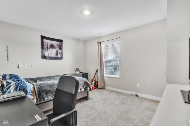 carpeted bedroom with baseboards | Image 28