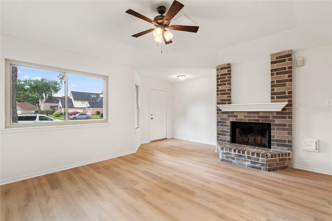 View toward front door shows open circulation paths and a nice mix of light and texture. | Image 6