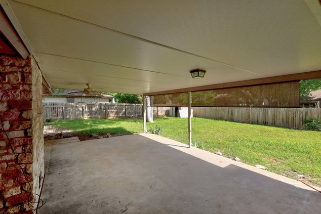 View of patio featuring a ceiling fan | Image 28