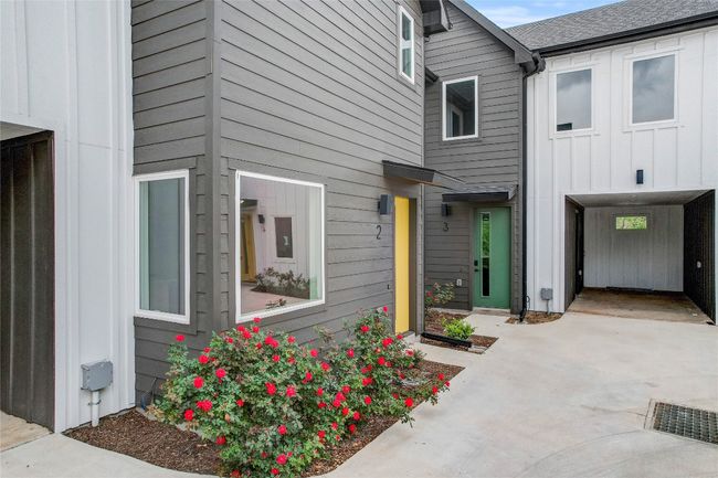 Entrance to property with board and batten siding and concrete driveway | Image 7