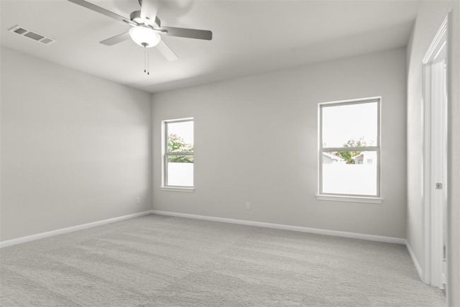 Spare room with light colored carpet, baseboards, and visible vents | Image 19