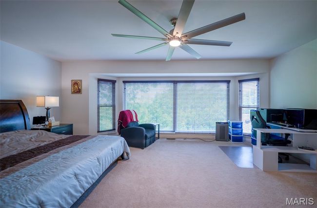 Bedroom featuring carpet flooring and ceiling fan | Image 26