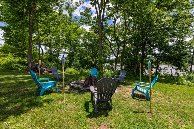 view of green lawn with a fire pit | Image 53