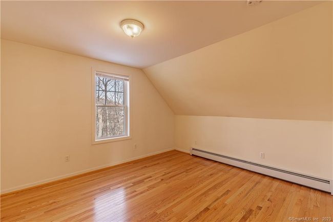 Additional bedroom with hardwood floors and angled ceiling (no closet) | Image 13