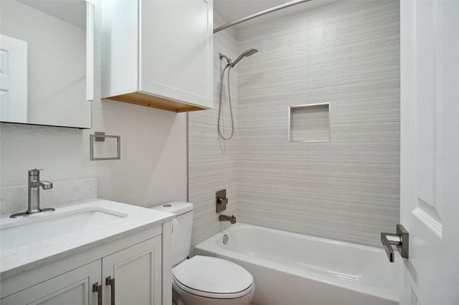 Bathroom with tub / shower combination and vanity | Image 17
