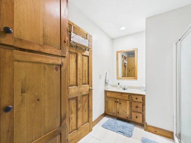 Bathroom featuring tile patterned floors, vanity, and baseboards | Image 28