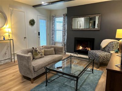 Living room featuring light wood-type flooring | Image 1