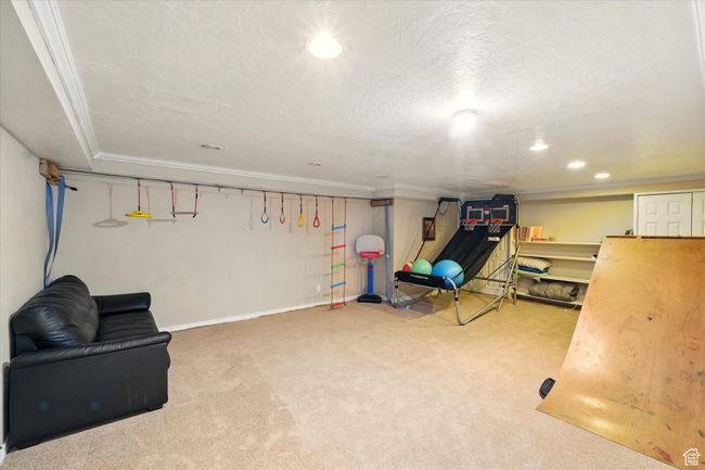 Sitting room with carpet, recessed lighting, ornamental molding, and a textured ceiling | Image 31