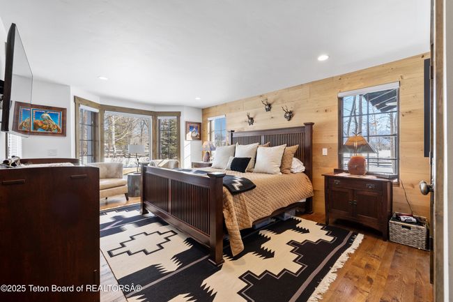 First floor primary bedroom with automatic shades and walk in closet. | Image 19