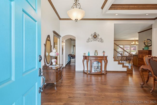Grand entry with hardwood floors and crown molding throughout! | Image 5