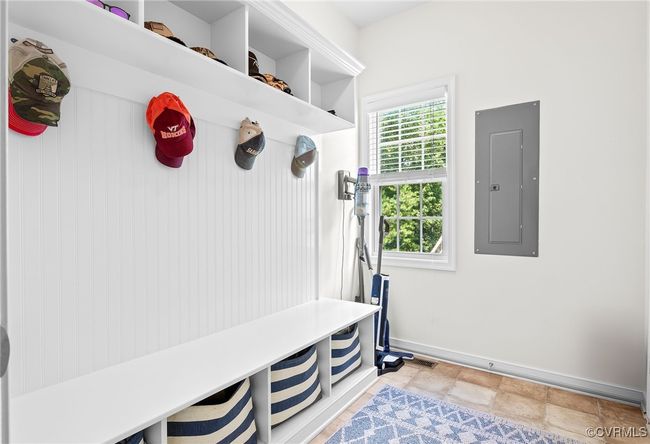 Mud room with an over 6' built in drop zone bench seat with storage cubbies, hooks and overall organization for a busy household | Image 19