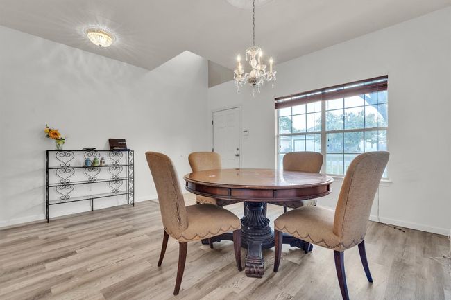 View of formal dining area from archway leading to the kitchen | Image 5