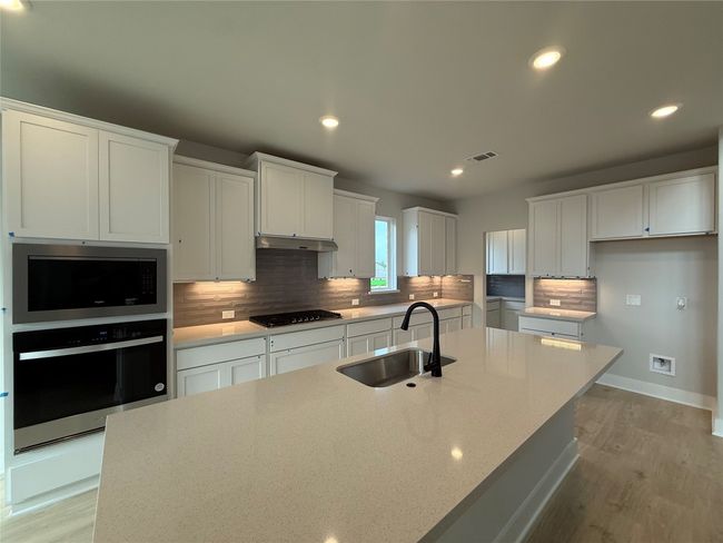 Light & Bright Open Concept Kitchen with large center island | Image 6