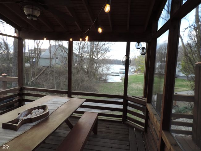 wooden terrace featuring a water view | Image 6