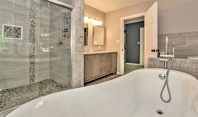 En-suite tub, vanity and shower with separate bathtub | Image 16