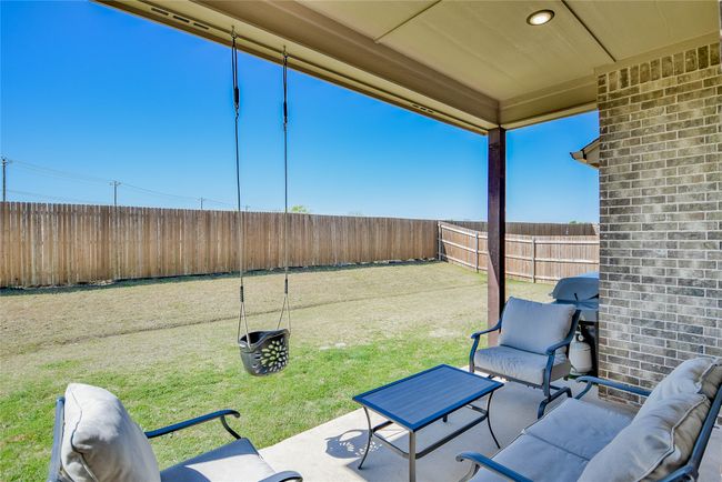 View of patio with a fenced backyard | Image 33