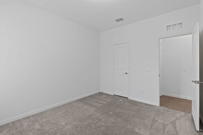 Unfurnished bedroom with carpet and baseboards | Image 16