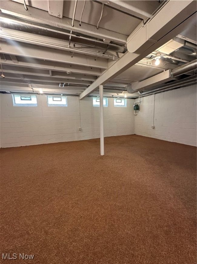 Basement featuring carpet flooring | Image 34