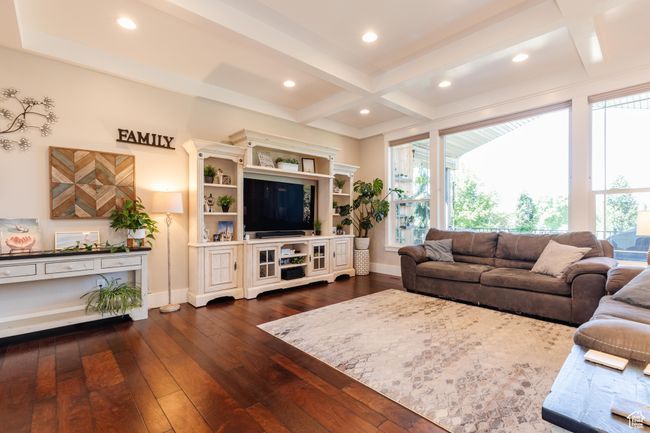 Living area with dark wood-style floors, coffered ceiling, beamed ceiling, and recessed lighting | Image 7