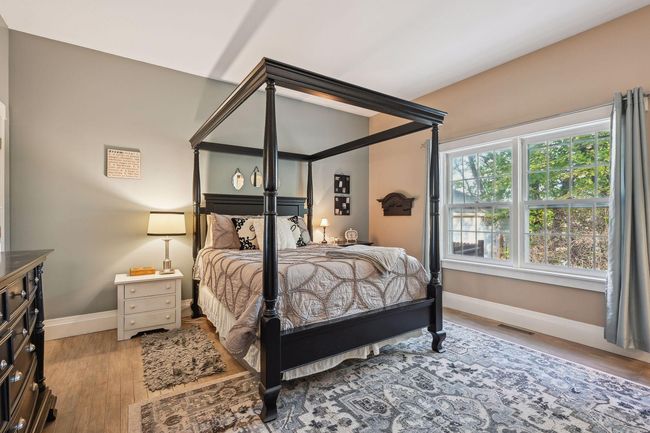 A spacious primary bedroom with beautiful views of the backyard. This room has had the floor resurfaced and fresh paint. It also has 2 separate closets, with one being a walk-in closet. | Image 26