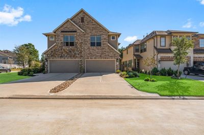 Driveway leads to private 2 car garage | Image 3