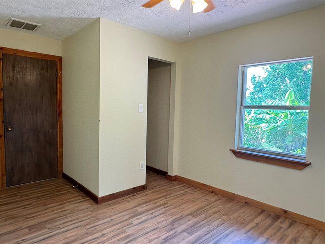 Flex room in garage has AC & can be a 4th bedroom. It's only 2-3 steps away from the main home. | Image 13