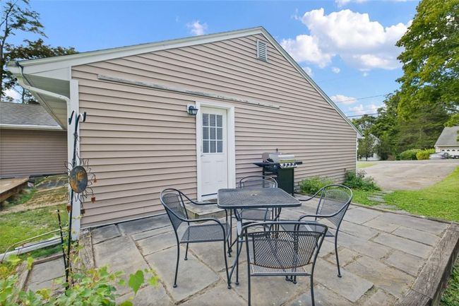 View of patio featuring grilling area | Image 29