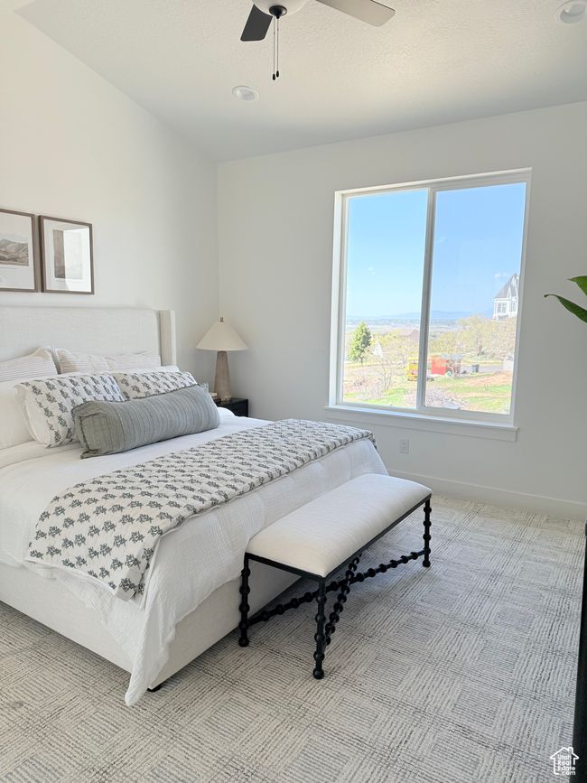 Primary Bedroom featuring light carpet, baseboards, and ceiling fan | Image 7