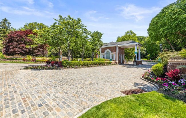 View of home's community featuring decorative driveway | Image 11