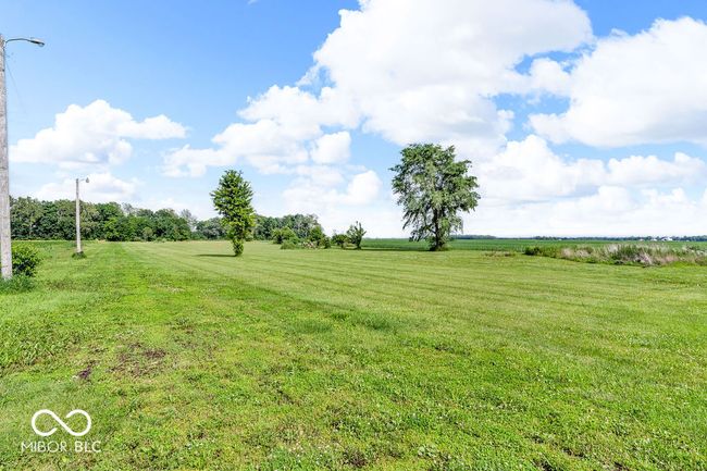 view of grassy yard featuring a view of rural / pastoral area | Image 48