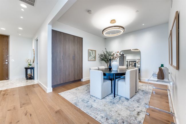 Dining area featuring arched walkways, light wood-style flooring, recessed lighting, and baseboards | Image 16
