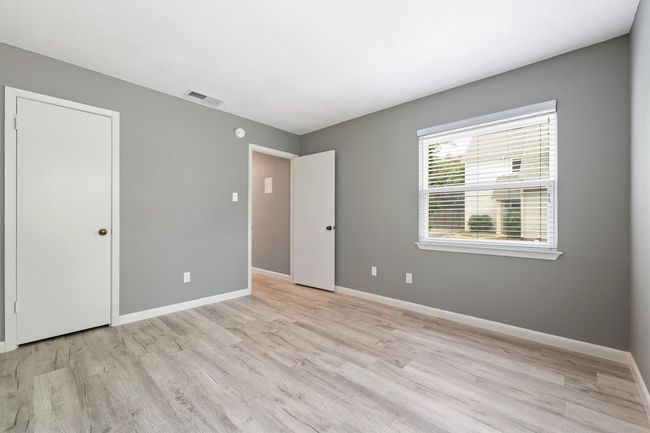 Unfurnished bedroom featuring light wood-style floors and baseboards | Image 18