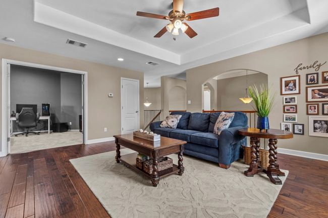 Crisp and classic, this updated bath features dual sinks, stylish cabinetry, and plenty of storage. | Image 29
