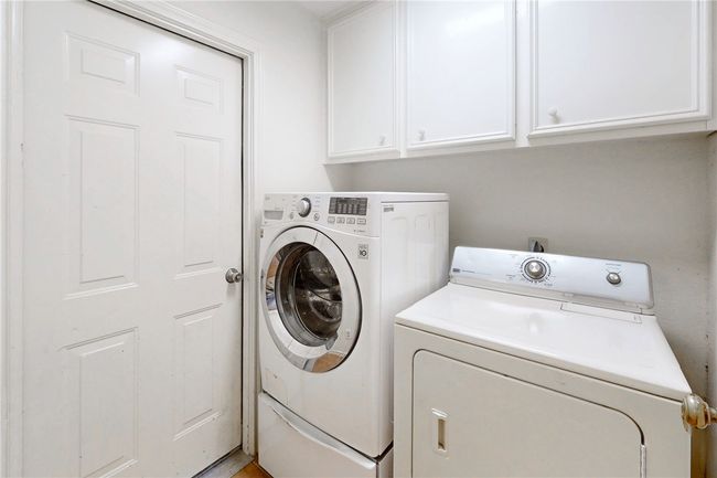 Laundry room with independent washer and dryer and cabinet space | Image 13
