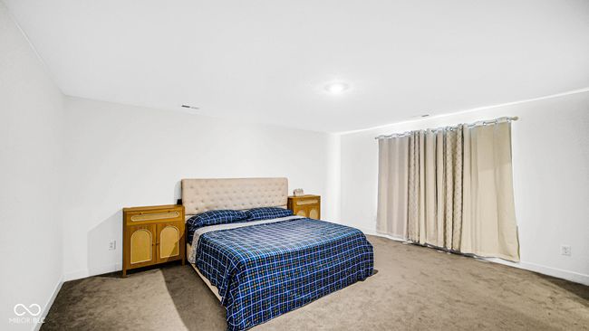 carpeted bedroom with baseboards | Image 30