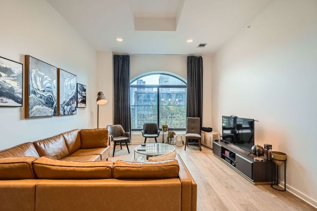 Living area featuring baseboards, light wood-type flooring, visible vents, and recessed lighting | Image 8