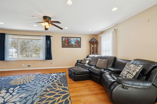 Living area featuring recessed lighting, a ceiling fan, and light wood finished floors | Image 12