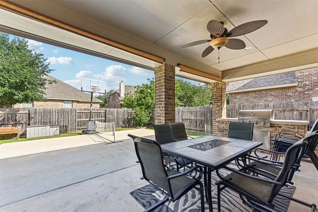 The expansive covered back patio is made for laid-back evenings, weekend BBQs, and everything in between | Image 31