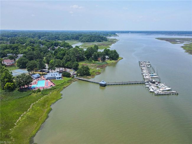Gatling Pointe Yacht Club with marina, pool, clubhouse, playground, volleyball and tennis/pickleball courts...membership is optional. | Image 47