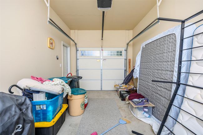 Garage with a garage door opener | Image 25