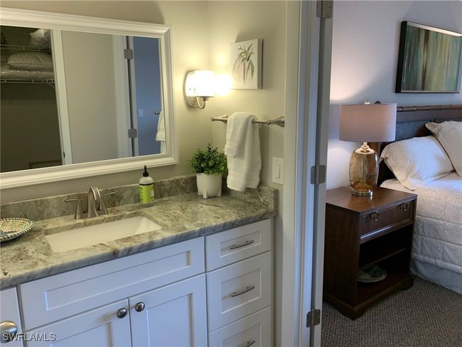 Bathroom featuring vanity and a walk in closet | Image 13