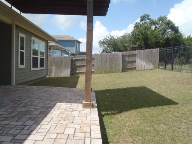 Fenced backyard featuring a patio | Image 7