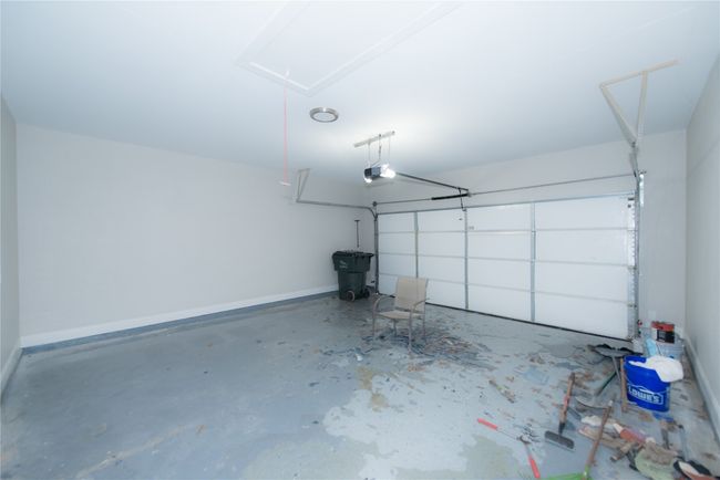 pardon the mess, still working on redoing flooring in garage. Insulated garage door and fully finished out garage. | Image 29